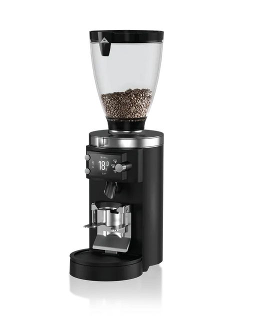Mahlkönig E65S GBW koffiemolen met zwarte behuizing en transparante bonenhouder gevuld met koffiebonen