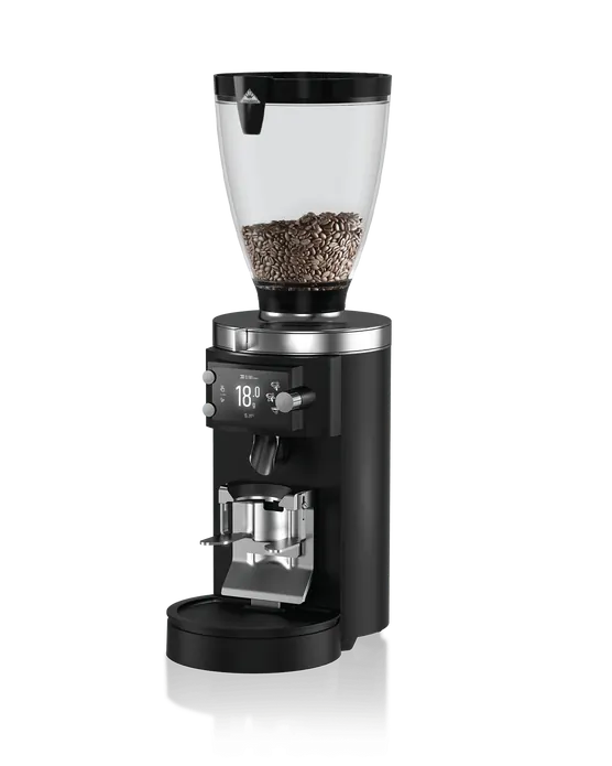 Mahlkönig E65S GBW koffiemolen met zwarte behuizing en transparante bonenhouder gevuld met koffiebonen