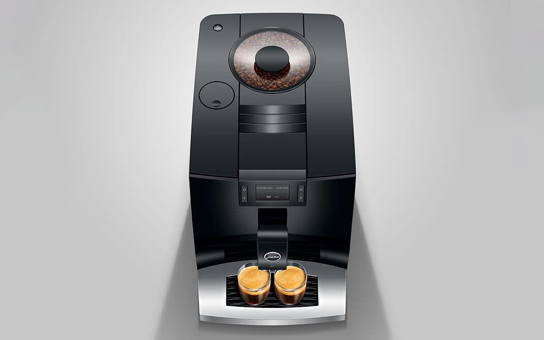 Bovenaanzicht van de ultracompacte JURA C3 met twee espresso's