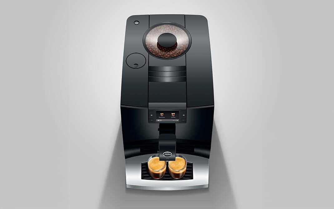 Bovenaanzicht van de compacte JURA C9 met twee espresso's