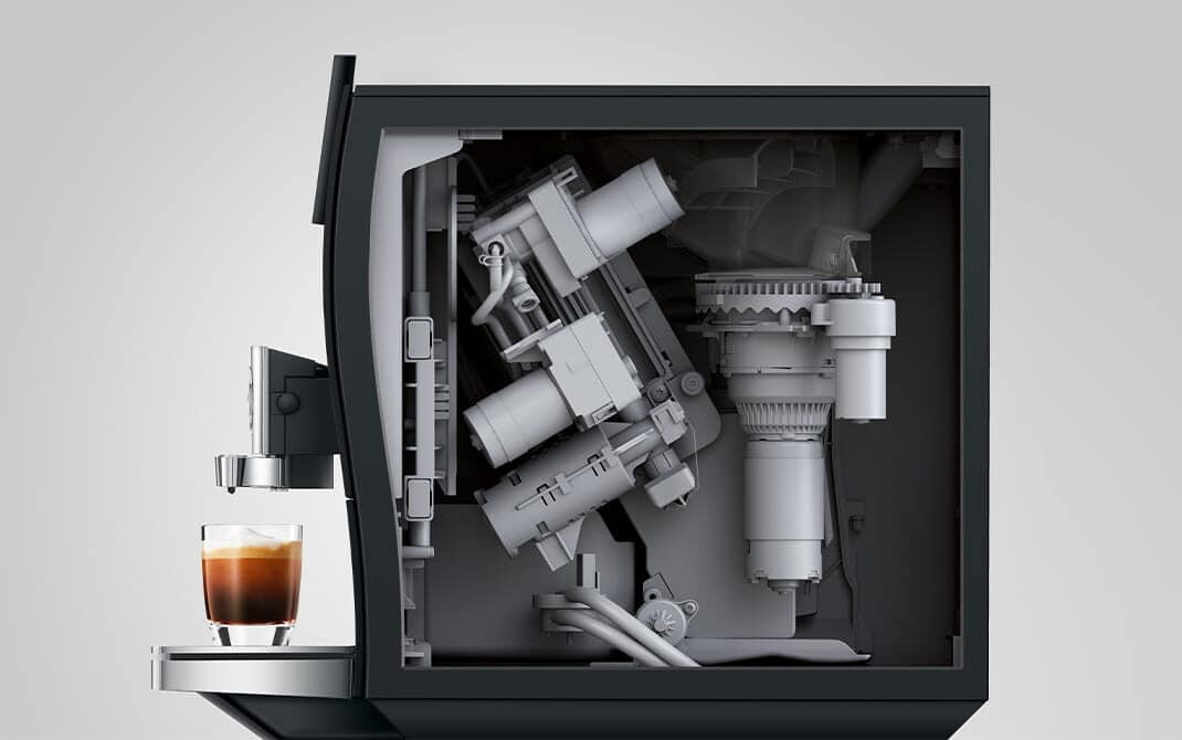 Binnenwerk van de JURA Z10 (EC) met het P.R.G.2+ maalwerk en een espresso