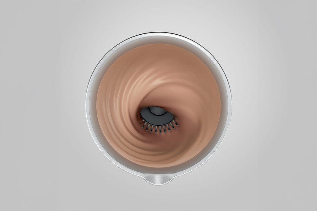 JURA melkopschuimer bovenaanzicht met draaiende garde in roestvrij stalen kan tijdens melkschuim bereiding