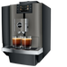 JURA X10c Dark Inox koffiemachine met touchscreen en twee glazen espresso op het lekrooster